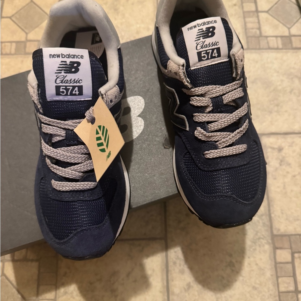 New Balance women’s 574 Navy and White Sneakers